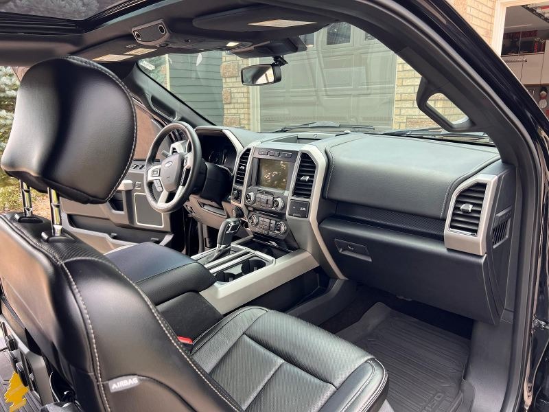 Ford F-150 interior after complete professional detailing, including deep cleaning of the seats, carpet, dashboard, and console, with leather conditioning and a fresh, spotless finish for a restored, like-new look