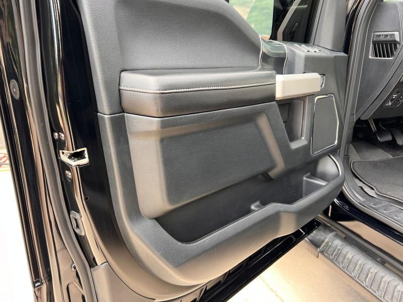 Ford F-150 door interior after professional detailing, including deep cleaning of the panels, conditioning of leather surfaces, and a polished, like-new finish for a fresh and well-maintained look