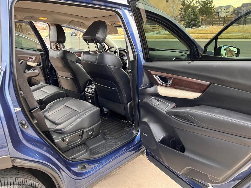 After detailing: Leather interior fully restored and conditioned, with clean, smooth seats and upholstery free from stains and discoloration, showcasing a fresh, luxurious appearance and enhanced durability