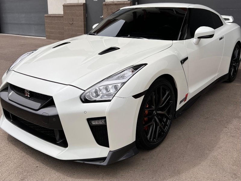 Other side of the 2018 Nissan GT-R showcasing a mirror-like finish after 4-step paint correction and 7-year ceramic coating, providing long-term protection against environmental contaminants, scratches, and water spots for a sleek, glossy look