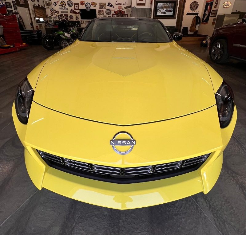 ellow Nissan Z with premium paint protection applied, featuring a flawless, high-gloss finish after advanced polishing, ceramic coating, and long-lasting sealant for superior defense against scratches, contaminants, and environmental damage