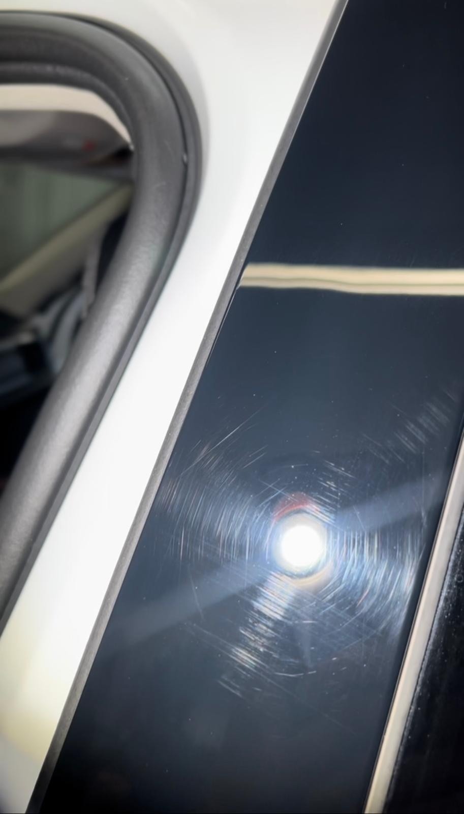 Before paint correction: Exterior plastic showing visible scratches, swirl marks, and imperfections, in need of professional paint correction and polish to restore a smooth, flawless finish