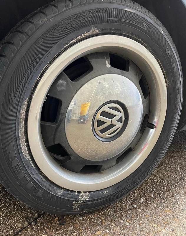Before cleaning: Wheel covered in brake dust, dirt, and grime, showing significant buildup on the surface, in need of professional cleaning and restoration to restore its shine and condition